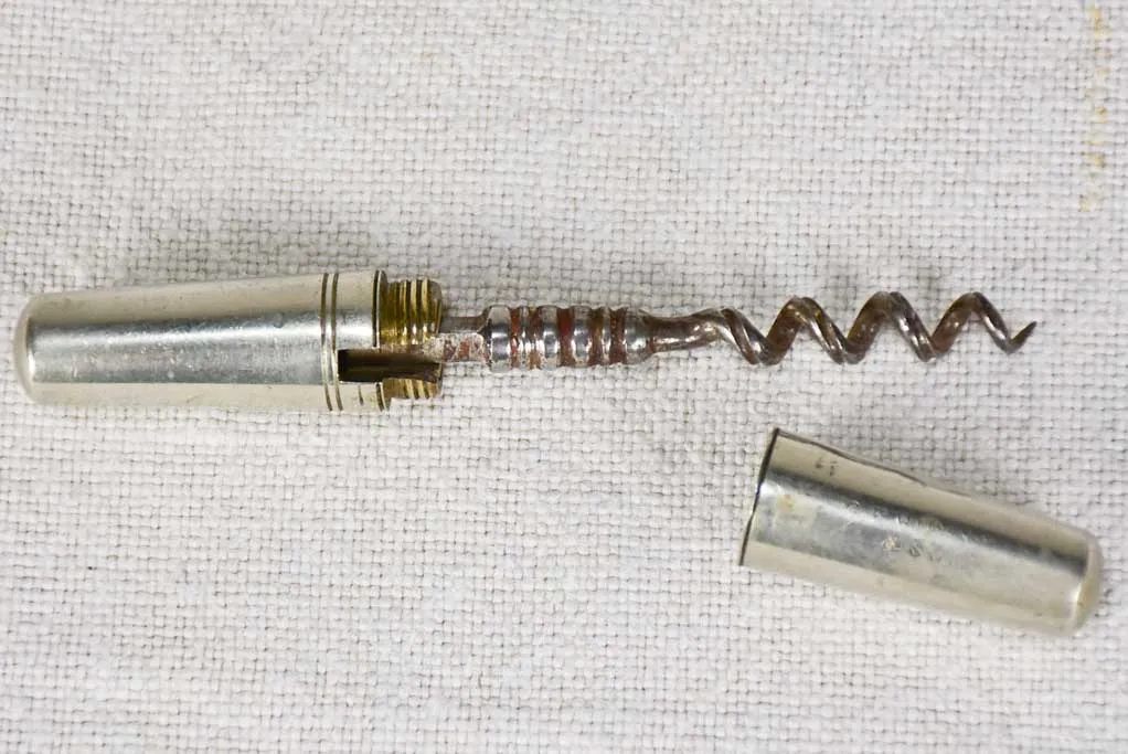 Early 20th century travel bottle opener in tapered case
