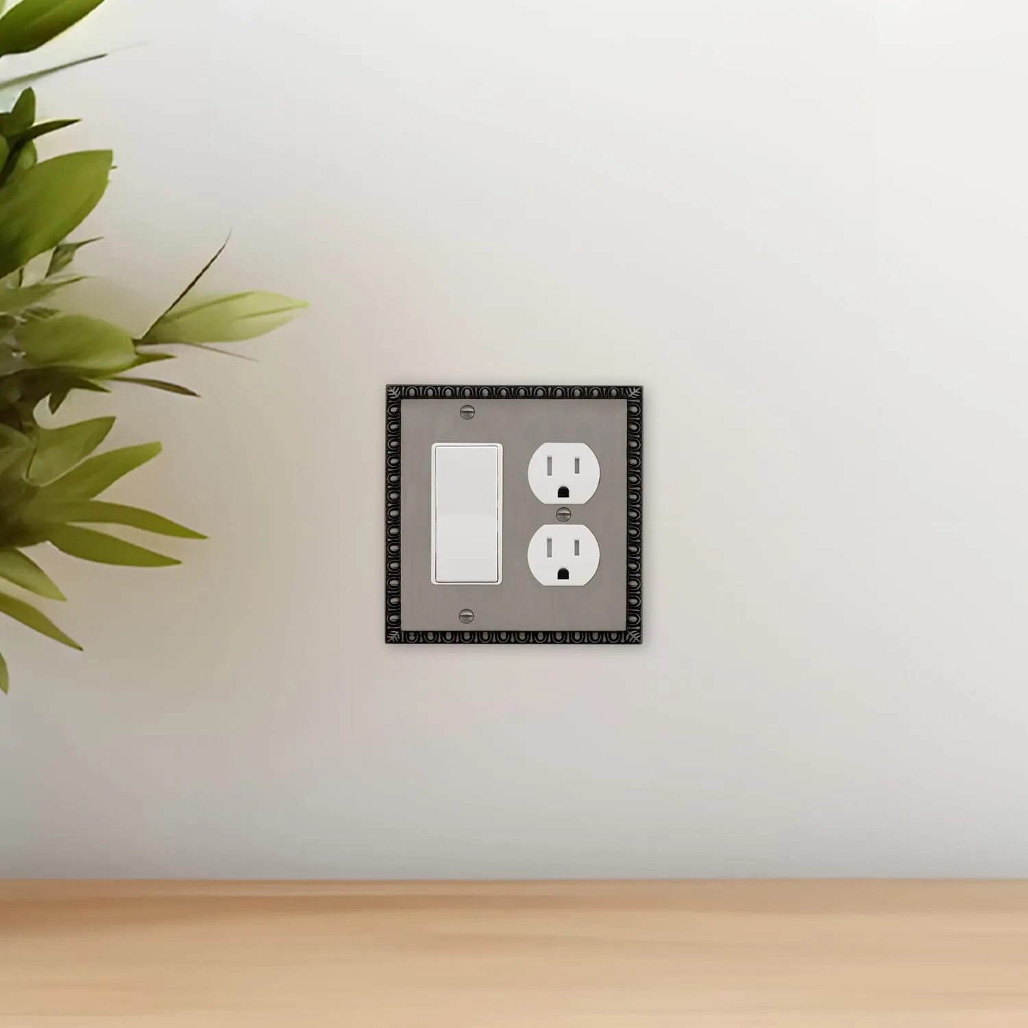 Egg & Dart Switch Plate with Rocker and Outlet in Antique Pewter