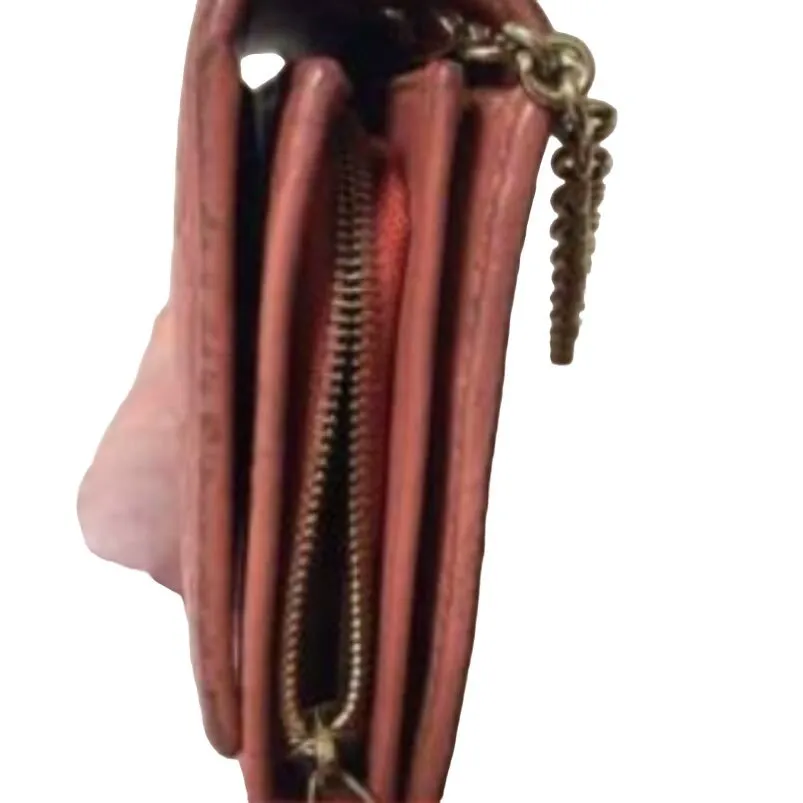 Gucci, salmon colored embossed Guccissima print leather, XL size, wallet on a removable chain