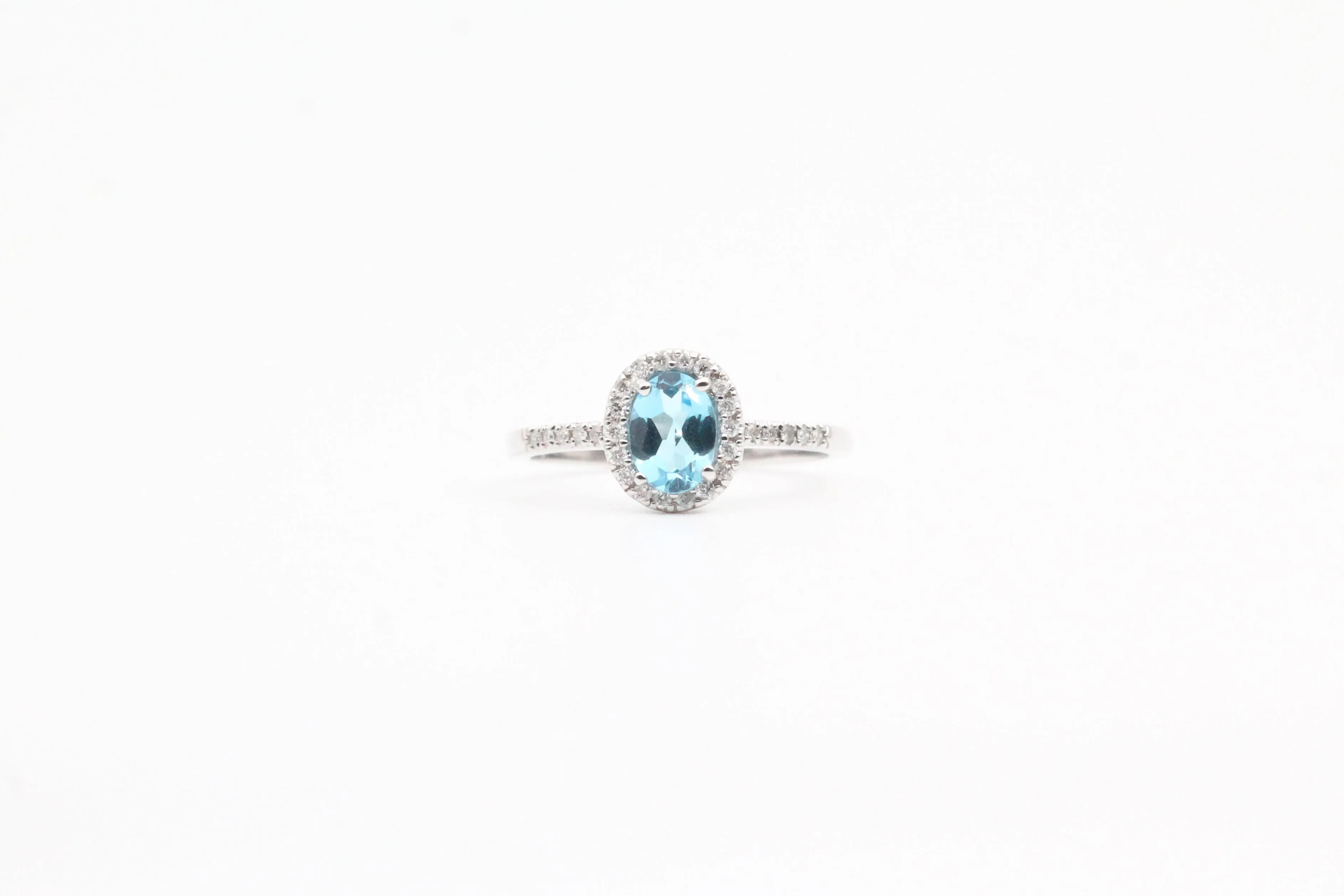 White Gold Blue Topaz and Diamond Halo Ring